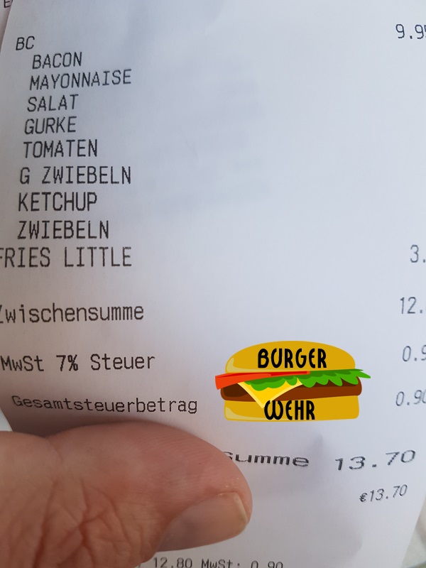 Kassenbon mit Auflistung aller Toppings auf dem Hamburger