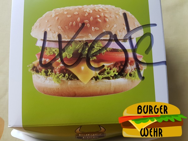 Bild einer Burgerschachtel mit einem Produktfoto eines Hamburgers